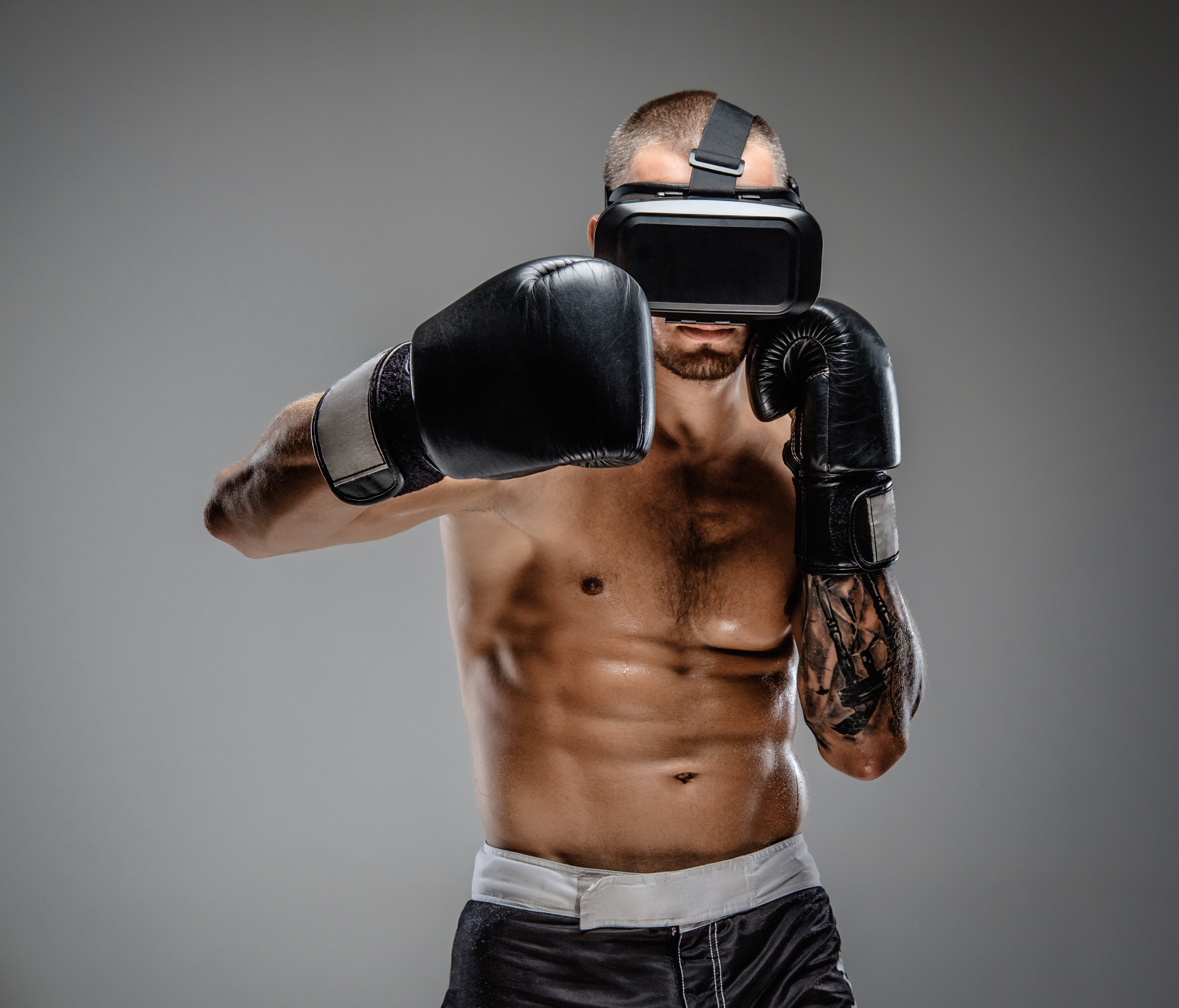 person boxing in the metaverse with virtual reality headset on